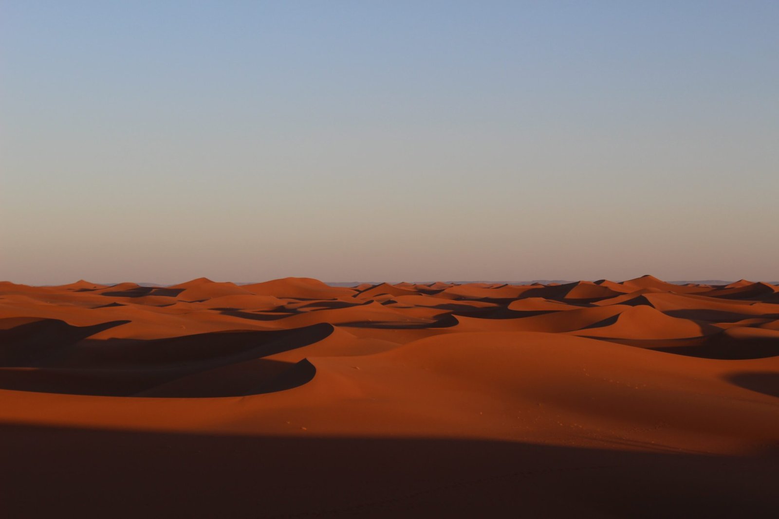 a vast expanse of sand dunes in the desert